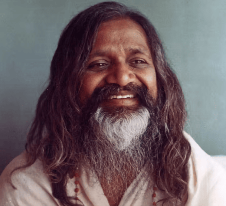 A portrait of Maharishi Mahesh Yogi, smiling and radiating peace and wisdom. The background is a serene and natural setting, symbolizing the simplicity and naturalness of the TM technique. The color palette is warm and inviting, conveying a sense of approachability. The style is photorealistic and aims to capture the essence of Maharishi's persona.
